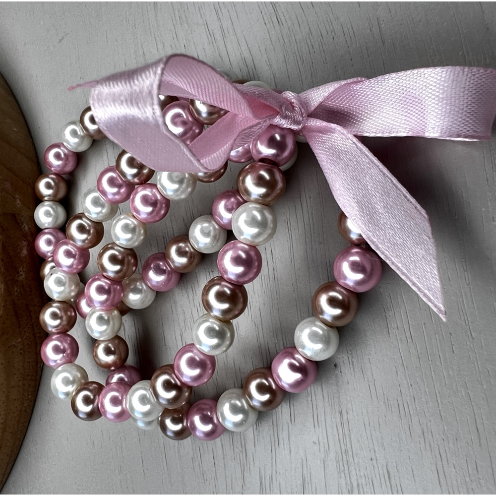 Set of 3 pink, ivory and beige faux pearl stretch bracelets with pink bow, new